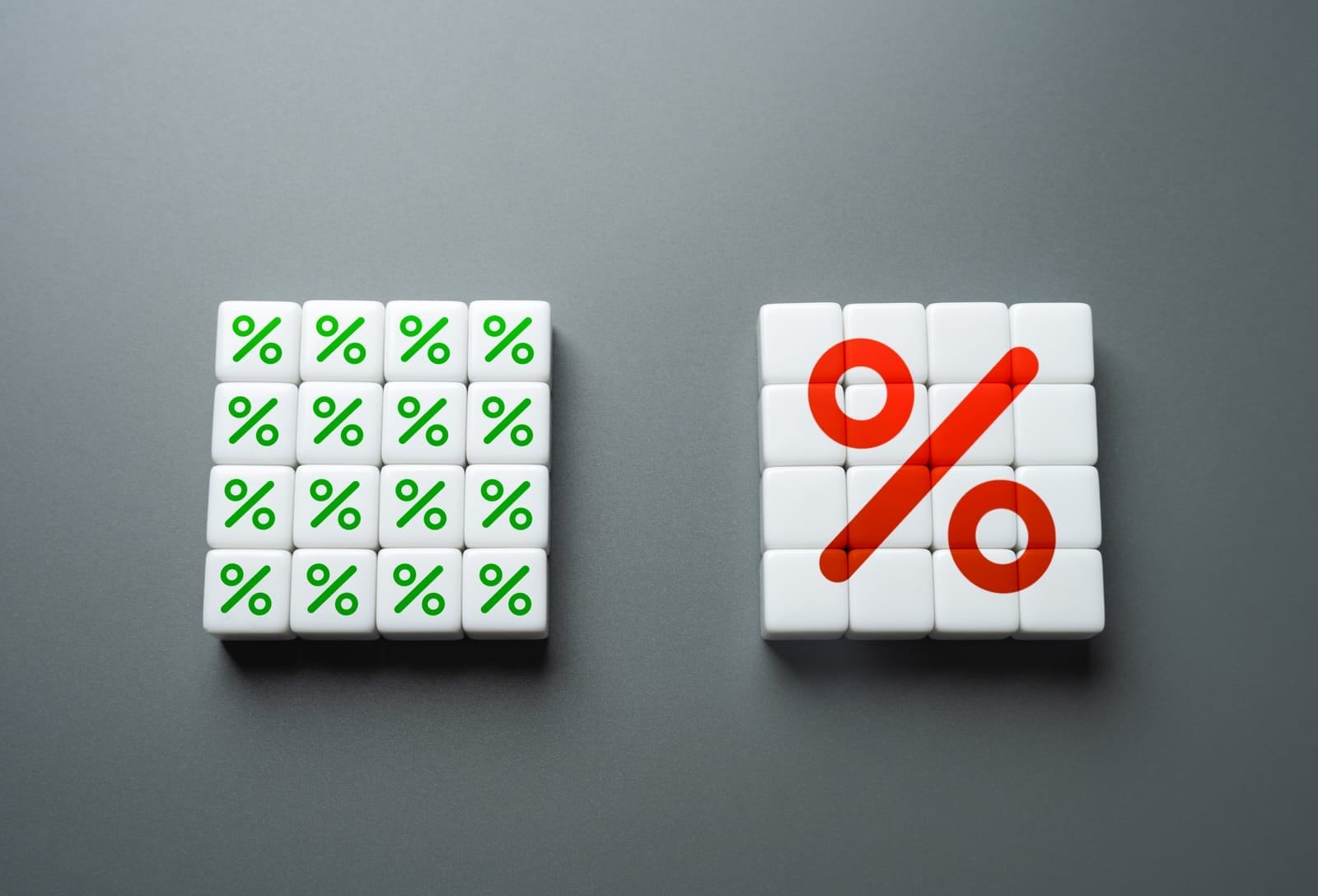 A grid of green percentage signs is on the left, composed of small square tiles. On the right, another grid of white tiles forms a large red percentage symbol, against a gray background.