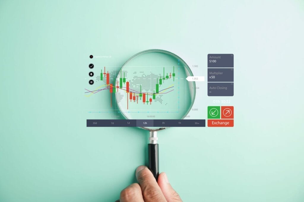 A hand holds a magnifying glass over a digital financial chart displayed on a turquoise background, highlighting various trading metrics, graphs, and exchange options.